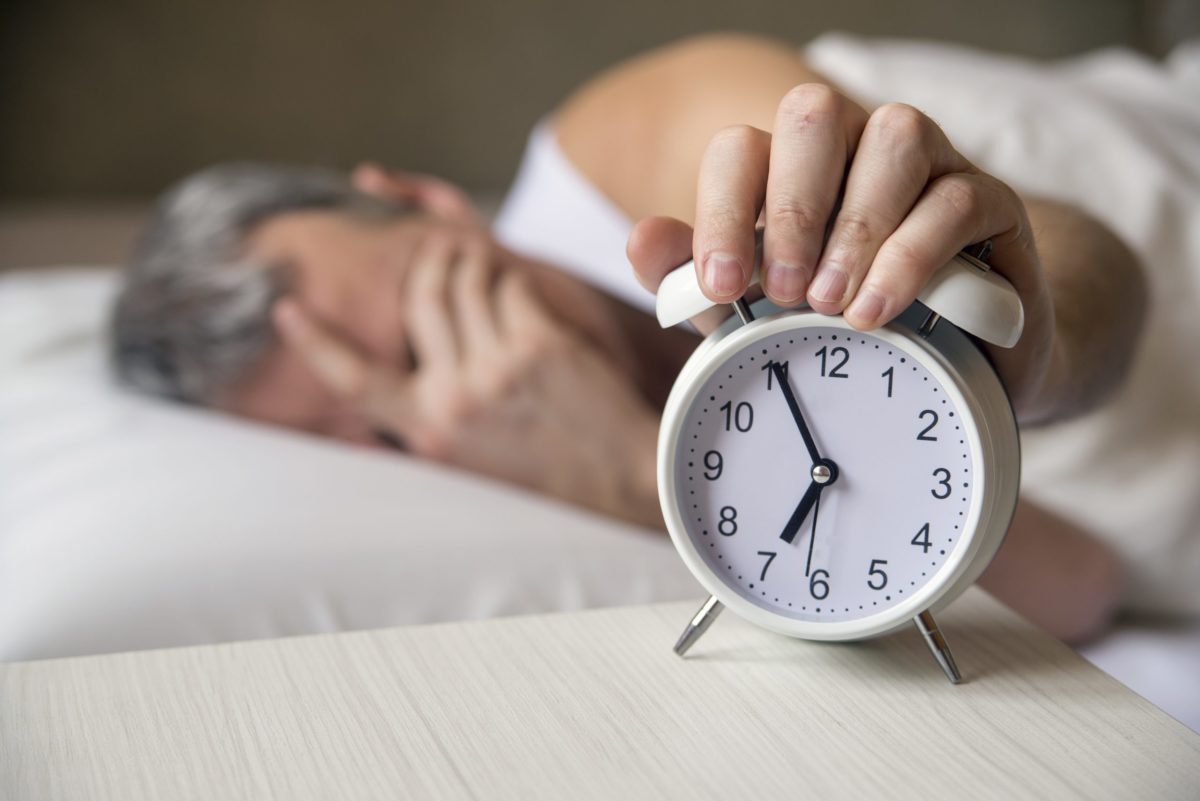 man-lying-bed-turning-off-alarm-clock-morning-7am-attractive-man-sleeping-his-bedroom-annoyed-man-being-awakened-by-alarm-clock-his-bedroom-scaled man-lying-bed-turning-off-alarm-clock-morning-7am-attractive-man-sleeping-his-bedroom-annoyed-man-being-awakened-by-alarm-clock-his-bedroom-scaled